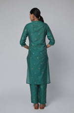 Back view of the Rama Green Chanderi Silk co-ord set, showing the elegant silhouette and smooth drape of the kurta and pants.