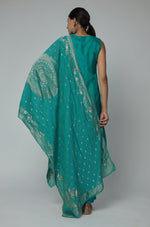 Back view of the Rama Green Banarasi Jacquard Chanderi suit set, showing the elegant silhouette and consistent woven jacquard pattern on the kurti and dupatta.