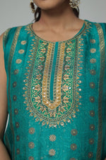 Close-up of the intricate gold Banarasi jacquard weaving on the V-neckline and front of the Rama Green Chanderi kurta.
