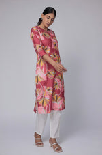 Model in a confident stance, highlighting the full length and overall vibrant floral print design of the red and pink multicolor cotton dobby kurti.