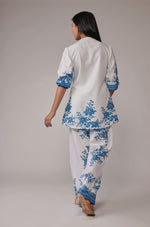  Back view of the elegant white with royal blue digital print co-ord set, showing the consistent pattern on the kurta and wide-leg pants.