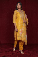 Close-up of the delicate shimmer organza fabric of the kurti and dupatta, and the soft texture of the muslin pant, highlighting material quality.