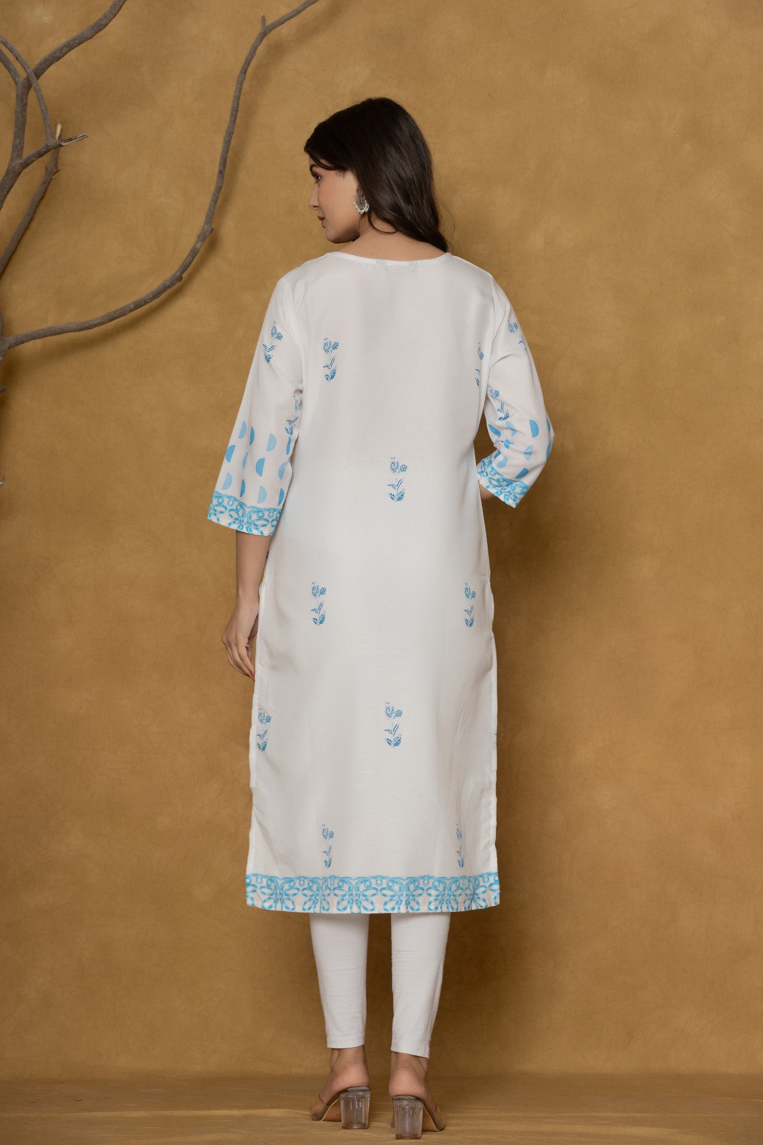 Back view of the white kurta, showing the clean design and the continuation of the blue print at the hem.