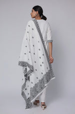 Back view of the off-white and black cotton jacquard dupatta set, showing the consistent pattern on the kurti and pants, with the matching patterned dupatta.