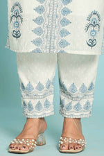Close-up of the white pant with intricate blue hand block print and delicate detailing at the hem, from the original hand block set.