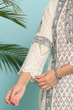 Detailed view of the intricate grey hand block print on the sleeves of the white kurta, showcasing the pattern and fabric texture.