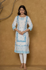 Model in a confident stance, highlighting the full length and overall detailed design of the white kurta with handwork.