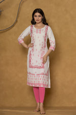 Model in a different pose wearing the white pannel kurta, highlighting the full length and the subtle pink floral patterns at the bottom.