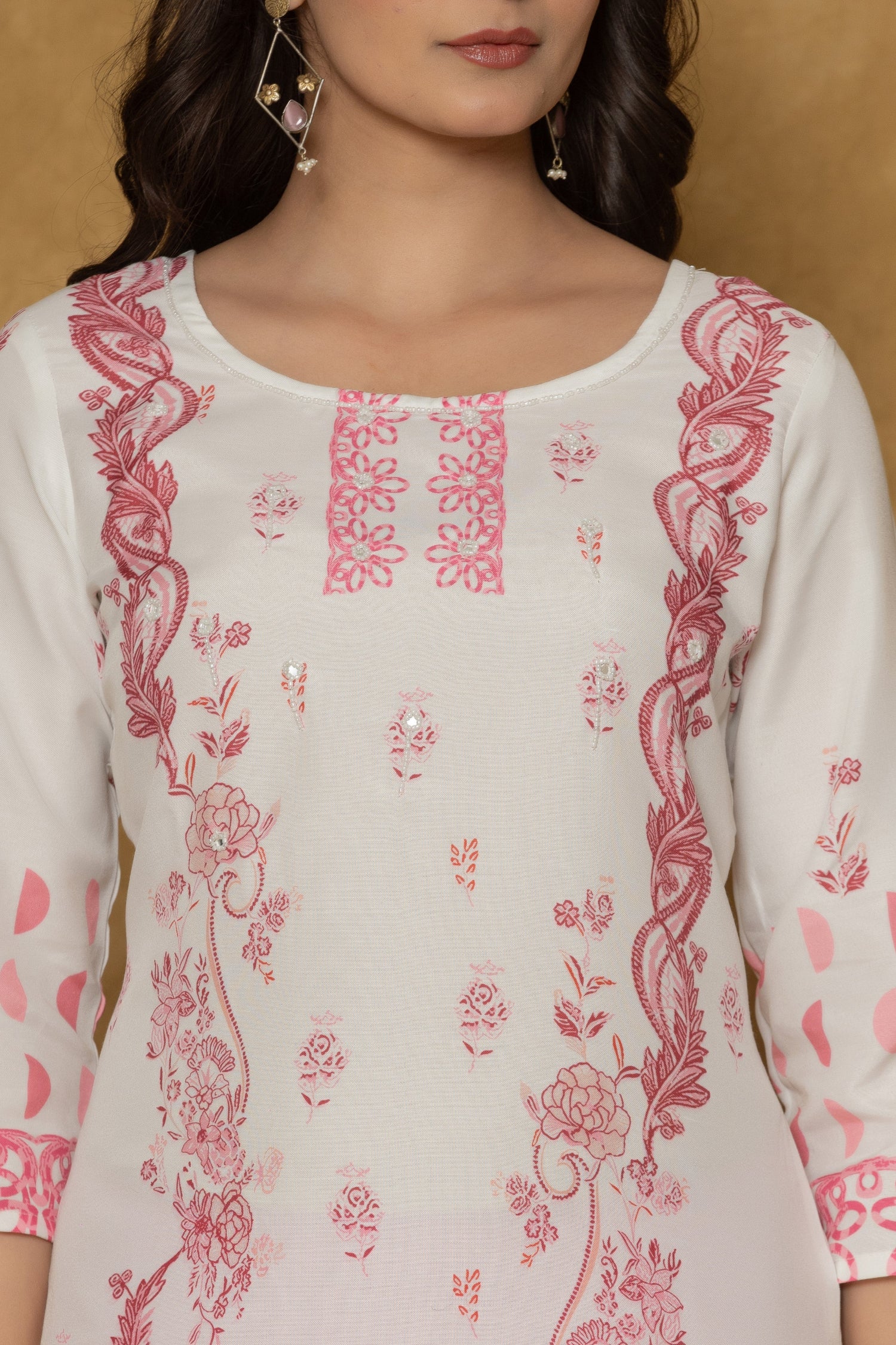 Close-up of the beautiful handwork embroidery and detailing on the round neckline of the white pannel kurta, highlighting craftsmanship.