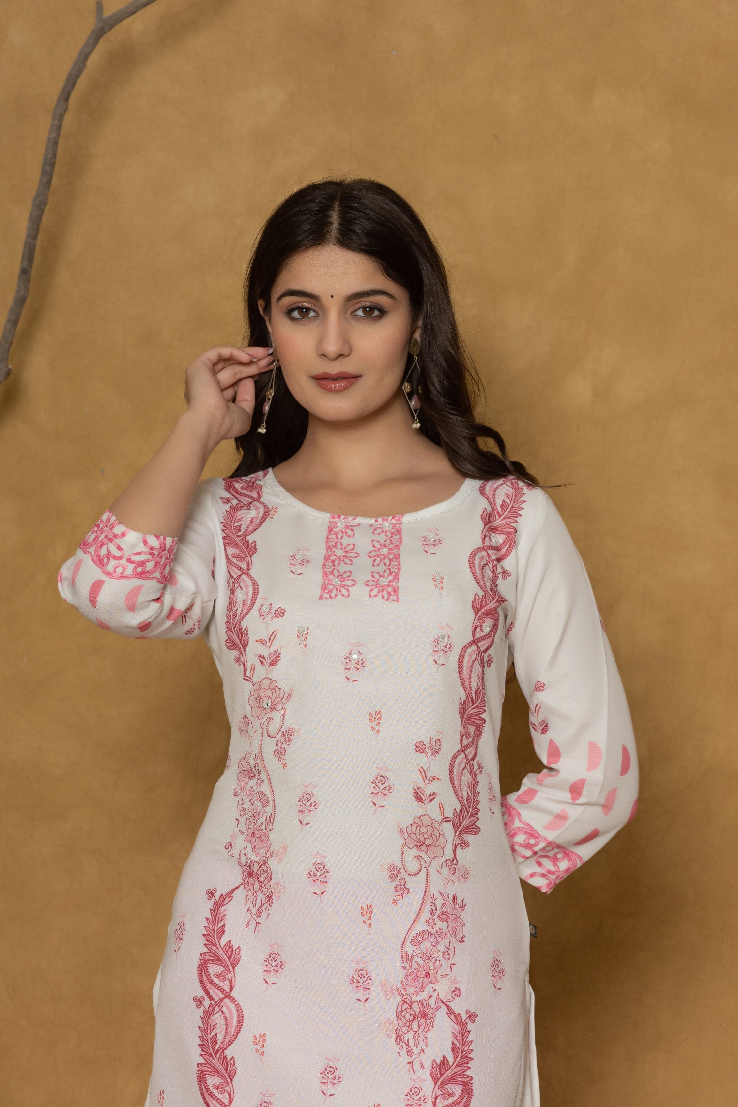 Side profile of model showcasing the comfortable fit and subtle elegance of the white pannel kurta with pink prints.