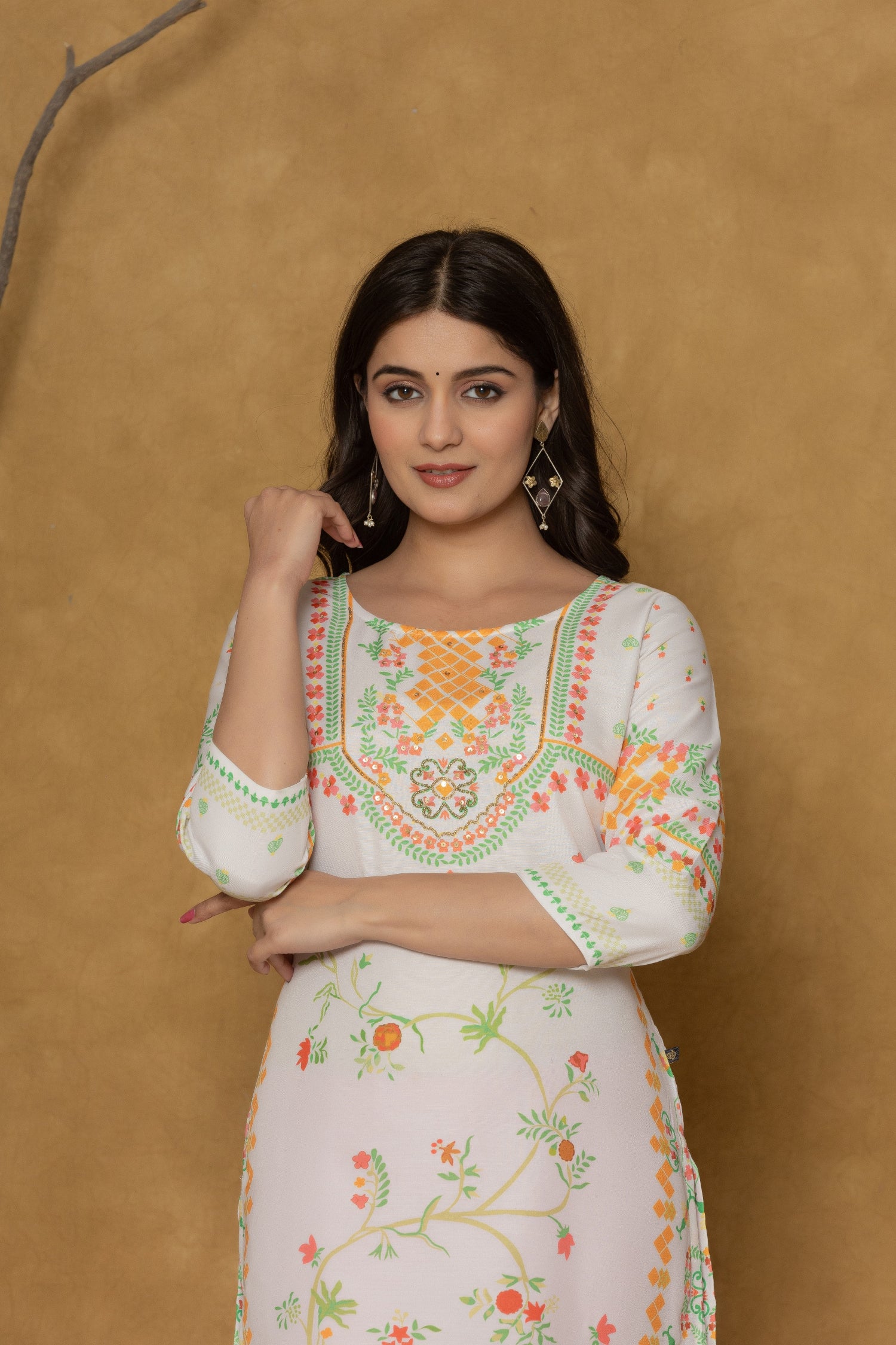 Side profile of model showcasing the comfortable fit and refreshing colors of the white and lime pannel kurta with floral prints.

