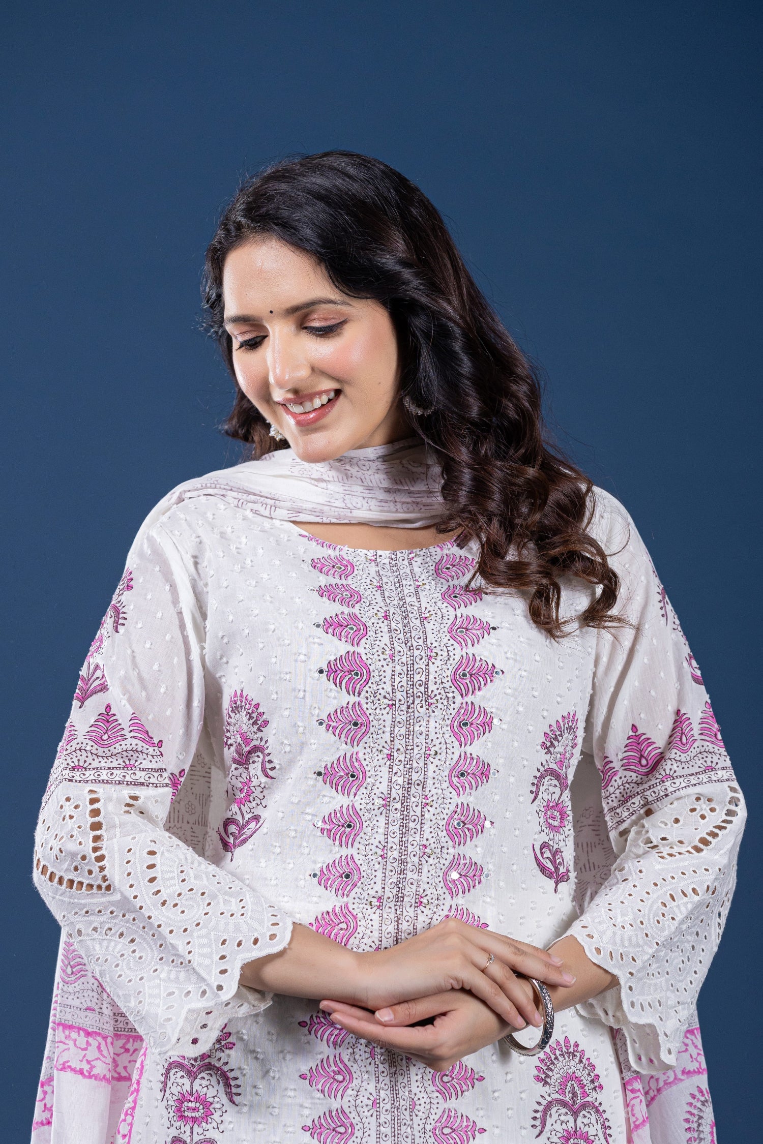 Side profile of model showcasing the comfortable fit and elegant drape of the white and pink original hand block dupatta set.