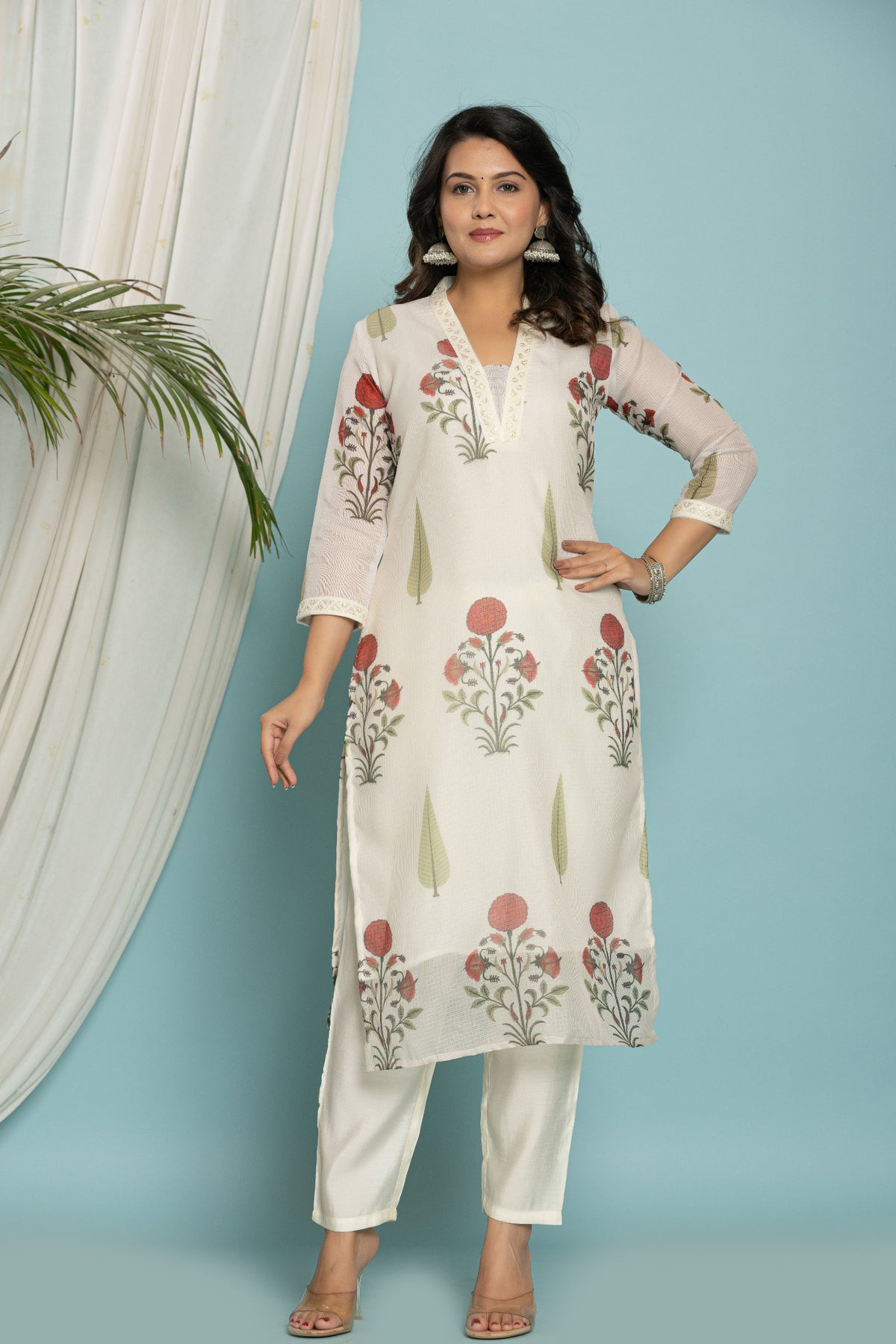 Model gracefully wearing the white floral printed Kota Doria dupatta set in a bright, relaxed setting, perfect for everyday elegance.