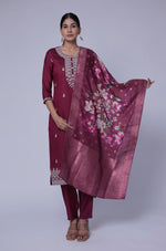 Model gracefully posing in the wine soft silk suit set, showcasing the fluidity and rich movement of the printed jacquard dupatta.
