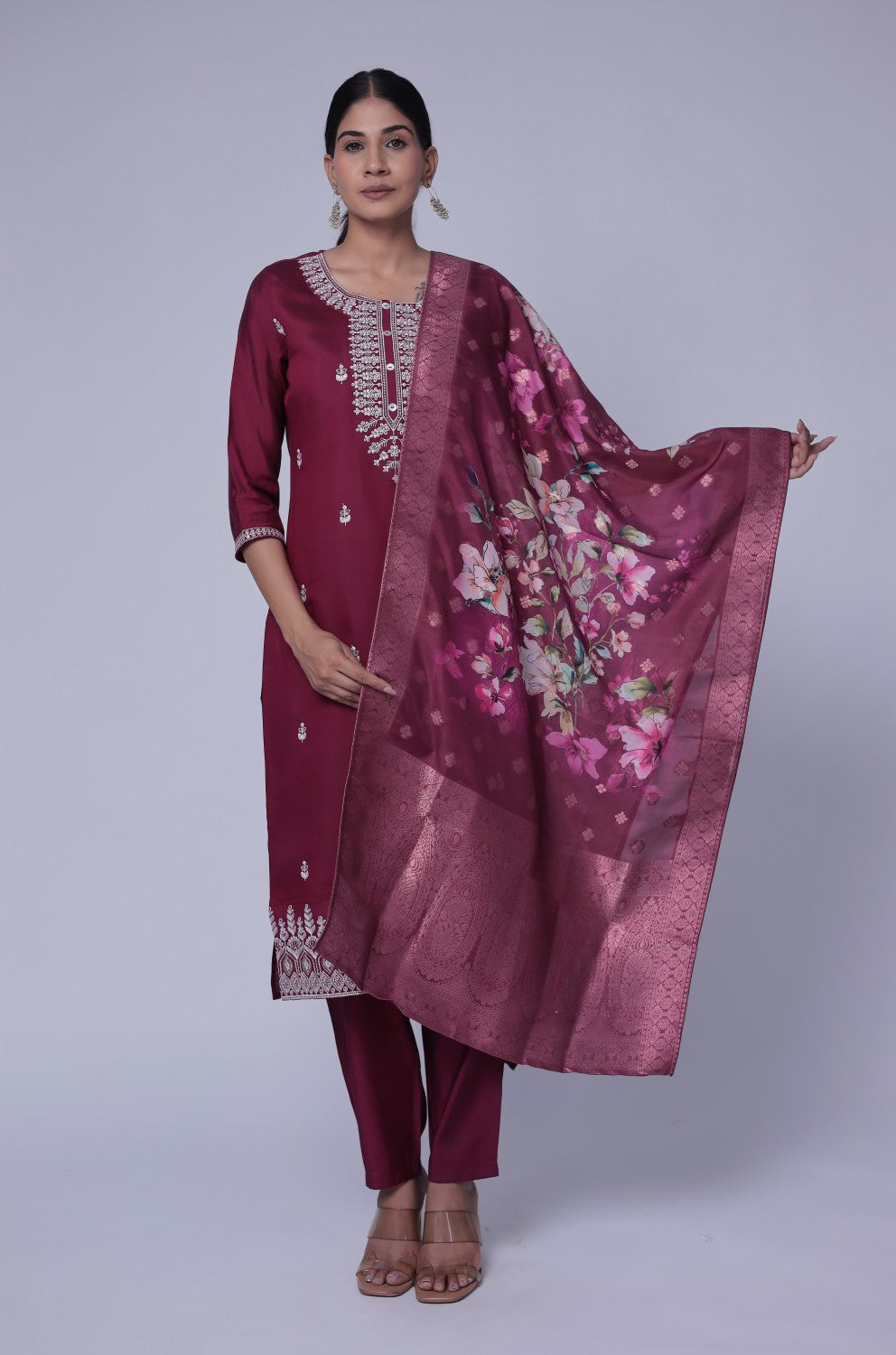 Model gracefully posing in the wine soft silk suit set, showcasing the fluidity and rich movement of the printed jacquard dupatta.