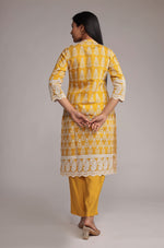 Back view of the yellow kurta pant set, showing the consistent allover embroidery and comfortable silhouette of the kurta and pants.