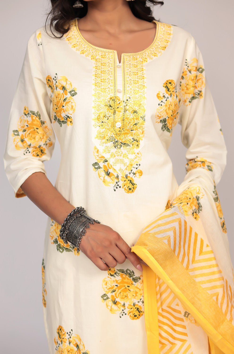 Detailed view of the yellow striped mulmul dupatta, showcasing its print and soft fabric texture, part of the Jaipuri kurta set.